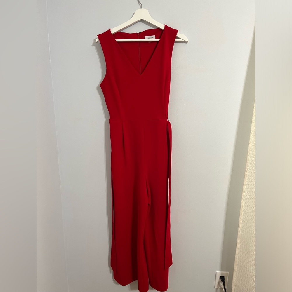 Red Calvin Klein red jump suit.